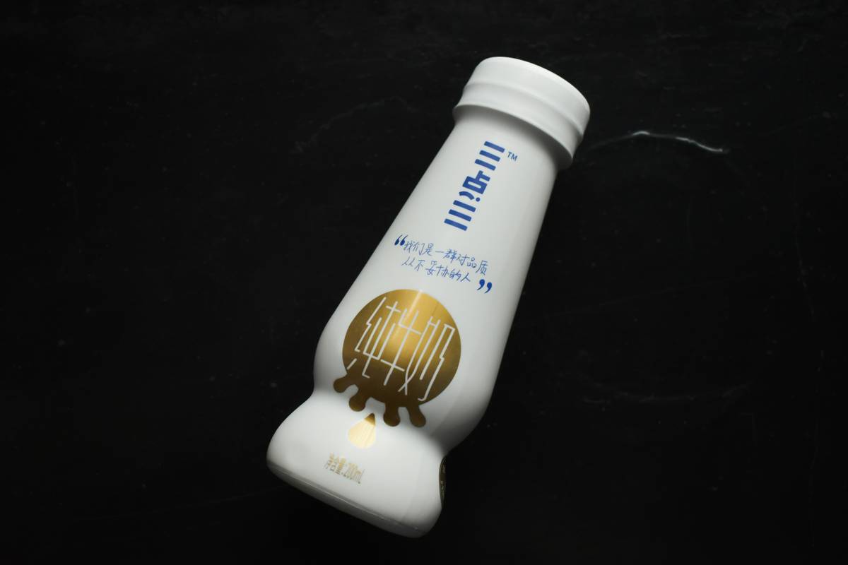 Delicious organic collagen bite sitting on a wooden plate surrounded by fresh berries